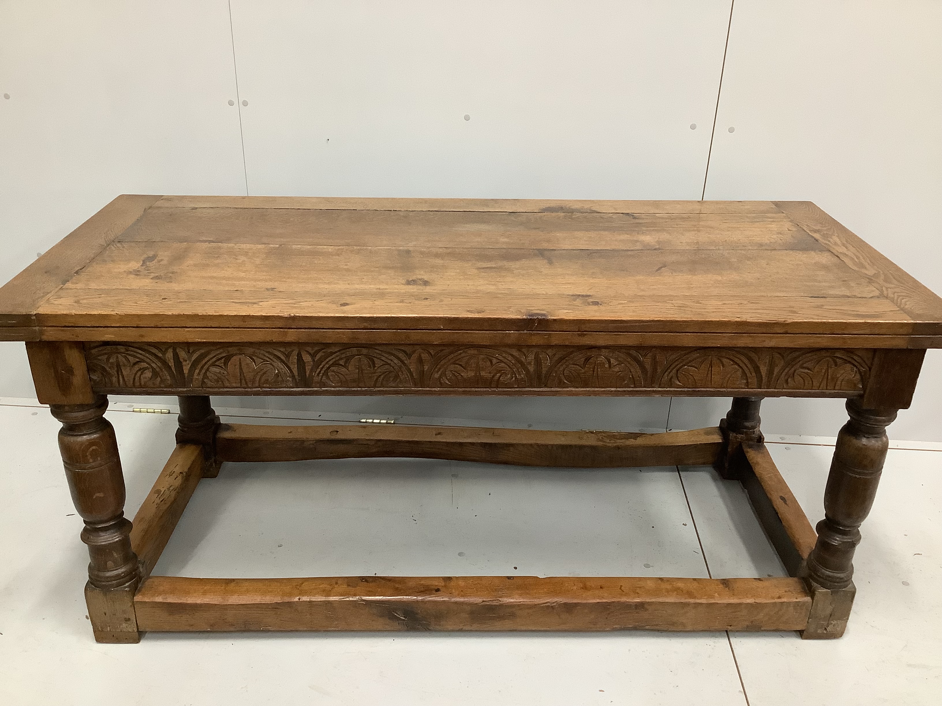 A 17th century style rectangular oak refectory dining table, incorporates old timber, width 168cm, depth 73cm, height 73cm